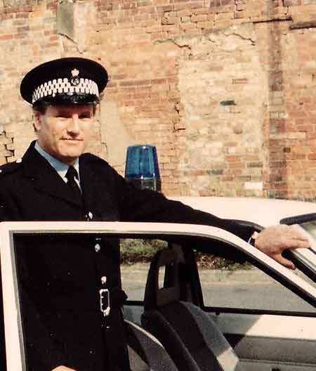 distant photo of sheffields sean glenn dressed as a police officer acting in central televisions murphys mob